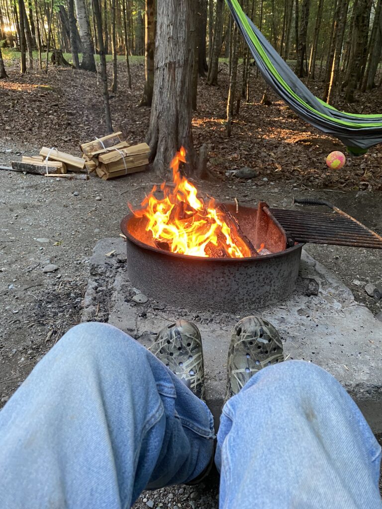 Motorhomes & Travel Trailers, Campfire with feet in foreground